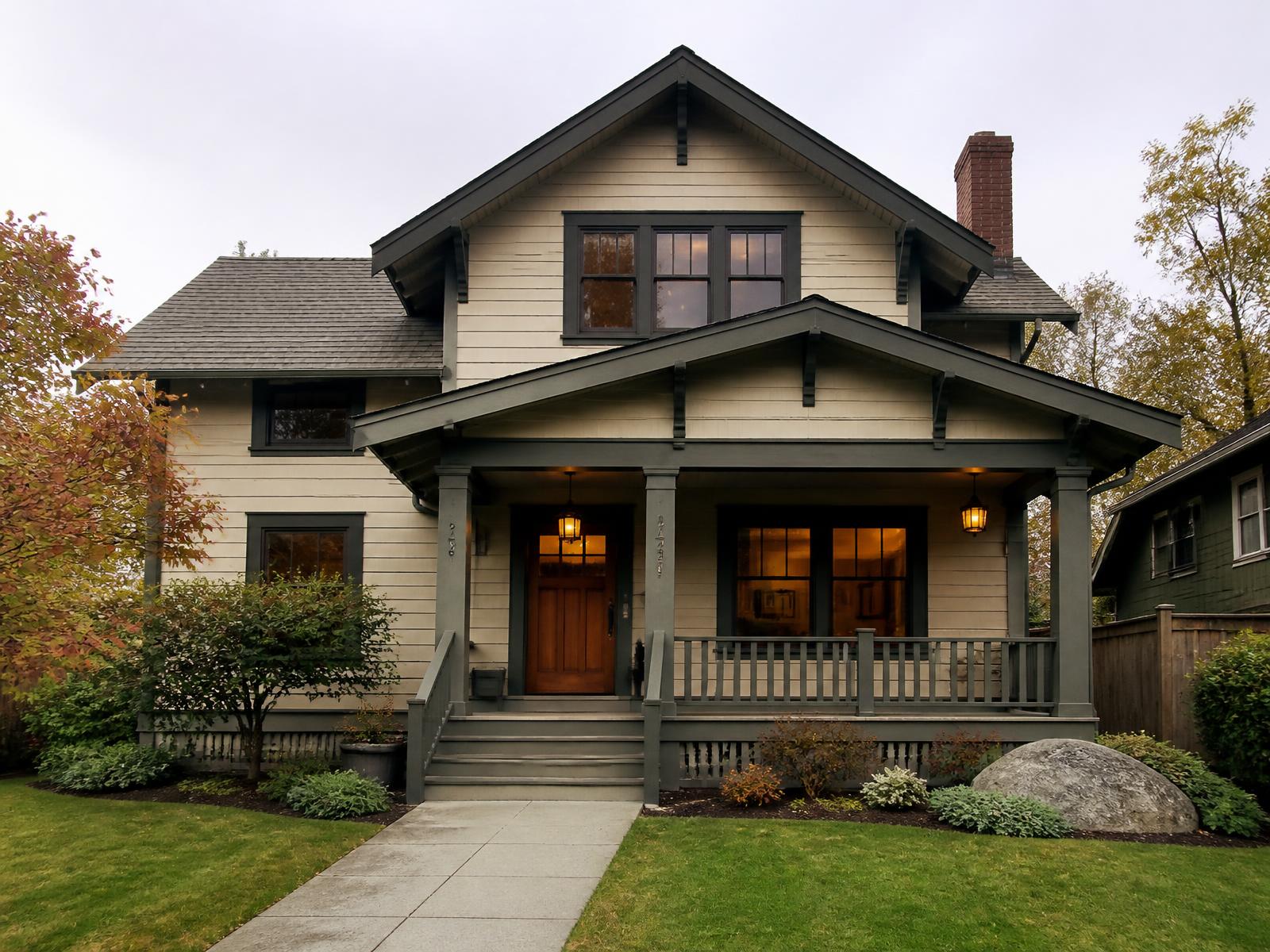 Completed craftsman-style home with cream siding and charcoal trim